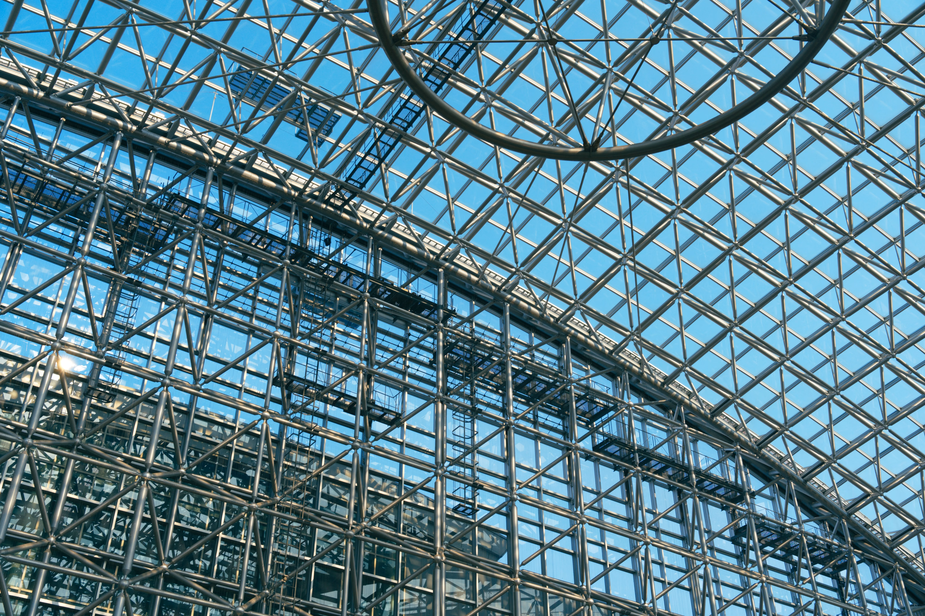 A glass-and-steel architectural pattern photographed in Kanazawa